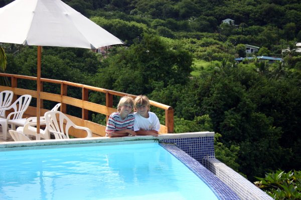 Boys by the infinity pool of the resort