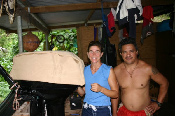 Sizing the motor cover that I am sewing for Serge's new outboard motor in return for a tiki he has carved.