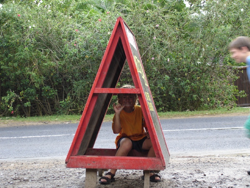 Waiting for the pizza place to open and dodging some rain.